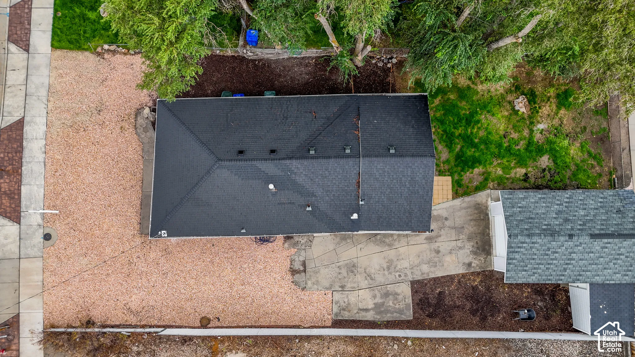 Gable roof structure with dark shingle roofing