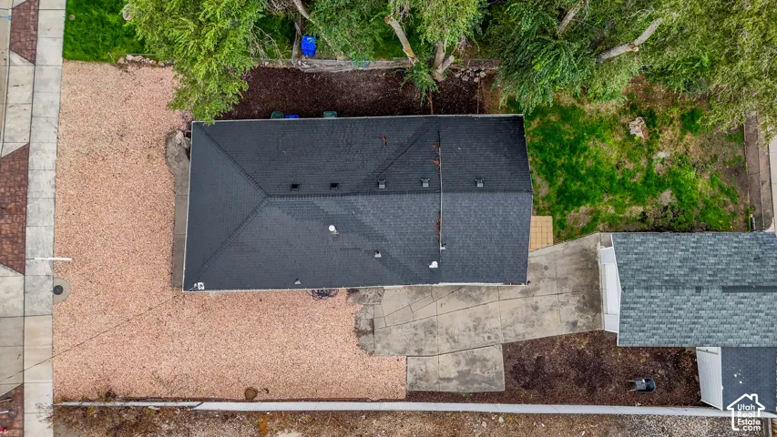 Gable roof structure with dark shingle roofing