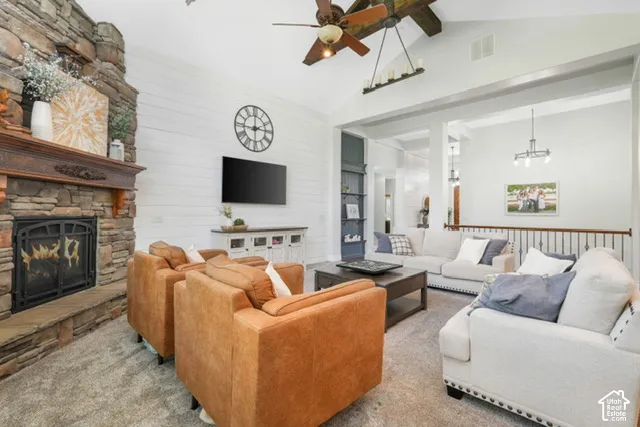 Stacked stone fireplace with carved wood mantel