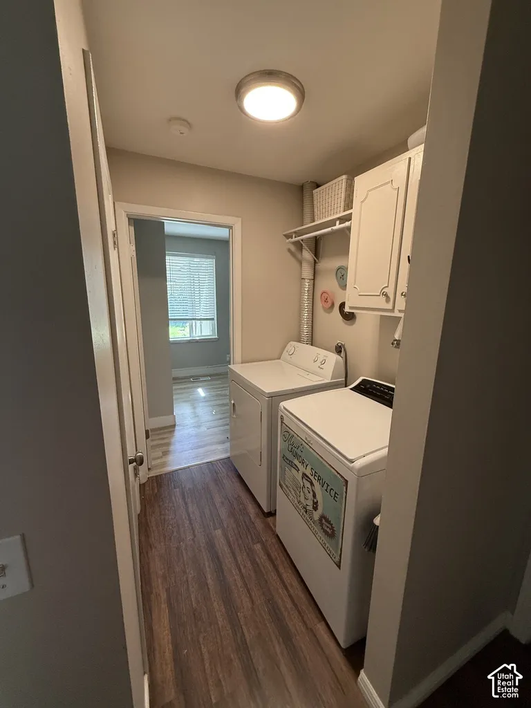 Laundry area featuring built-in white cabinetry with open shelving