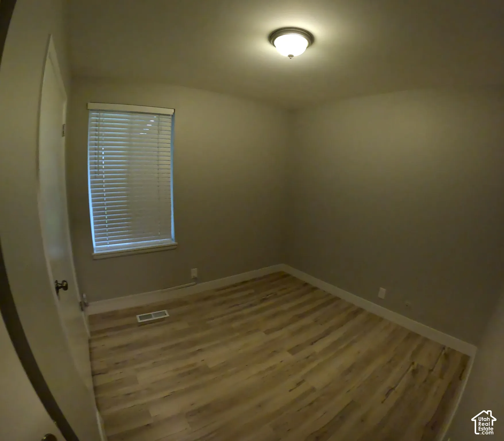 Vinyl flooring with neutral wall tones.
