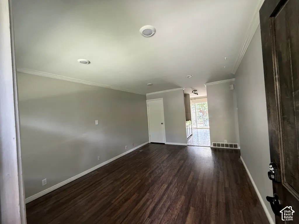 Recessed lighting, crown molding, and crisp white trim
