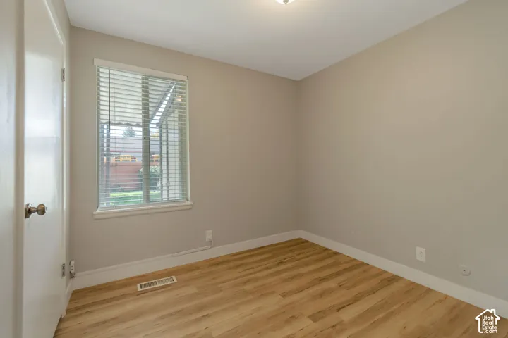 Vinyl plank flooring with neutral wall tones.