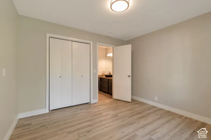 Vinyl plank flooring and a bi-fold closet.
