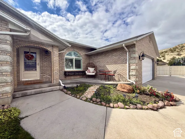 Brick exterior featuring stone accents and an arched entry