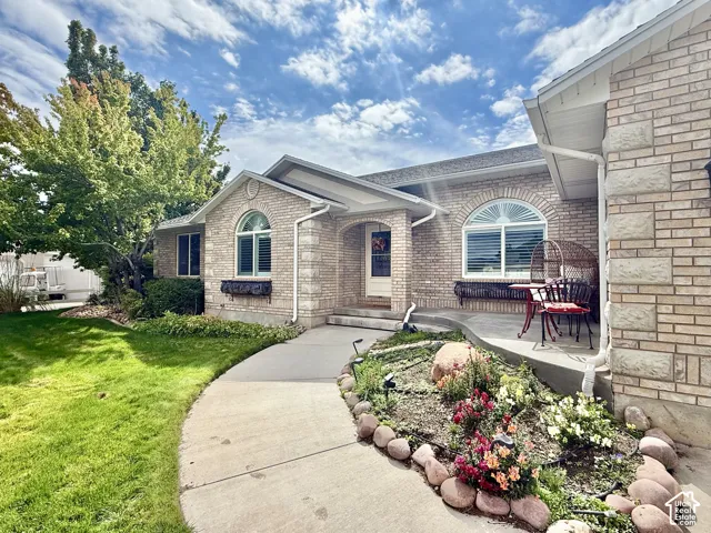 Brick exterior with stone accents and arched window