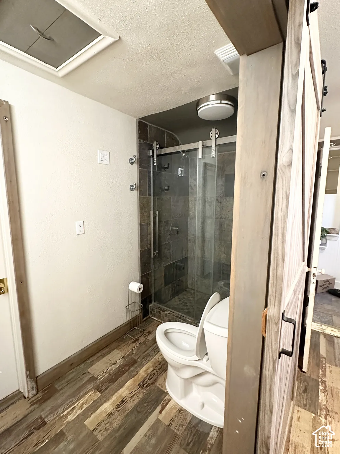 Walk-in shower with tiled surround and glass enclosure