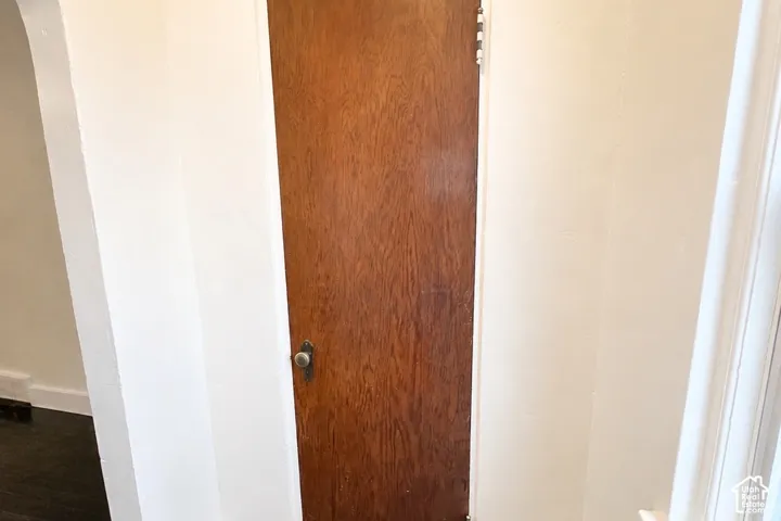 Wood-finish door with a knob handle