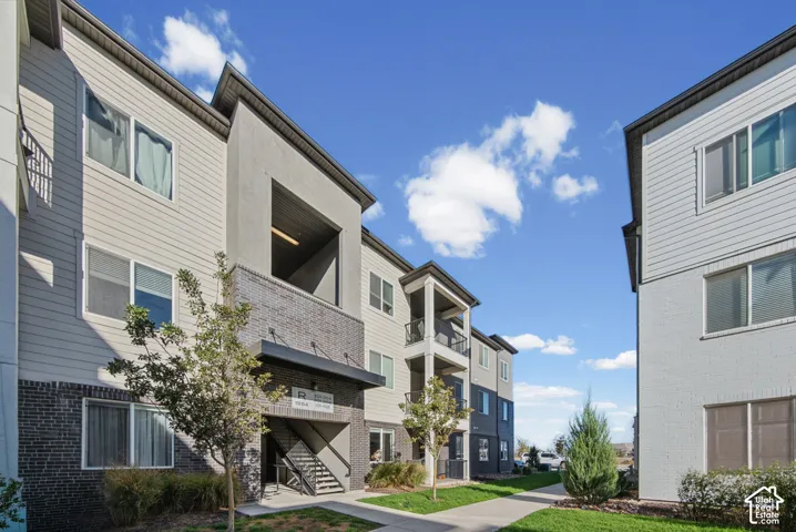 Multi-level exterior architecture featuring siding and brick accents
