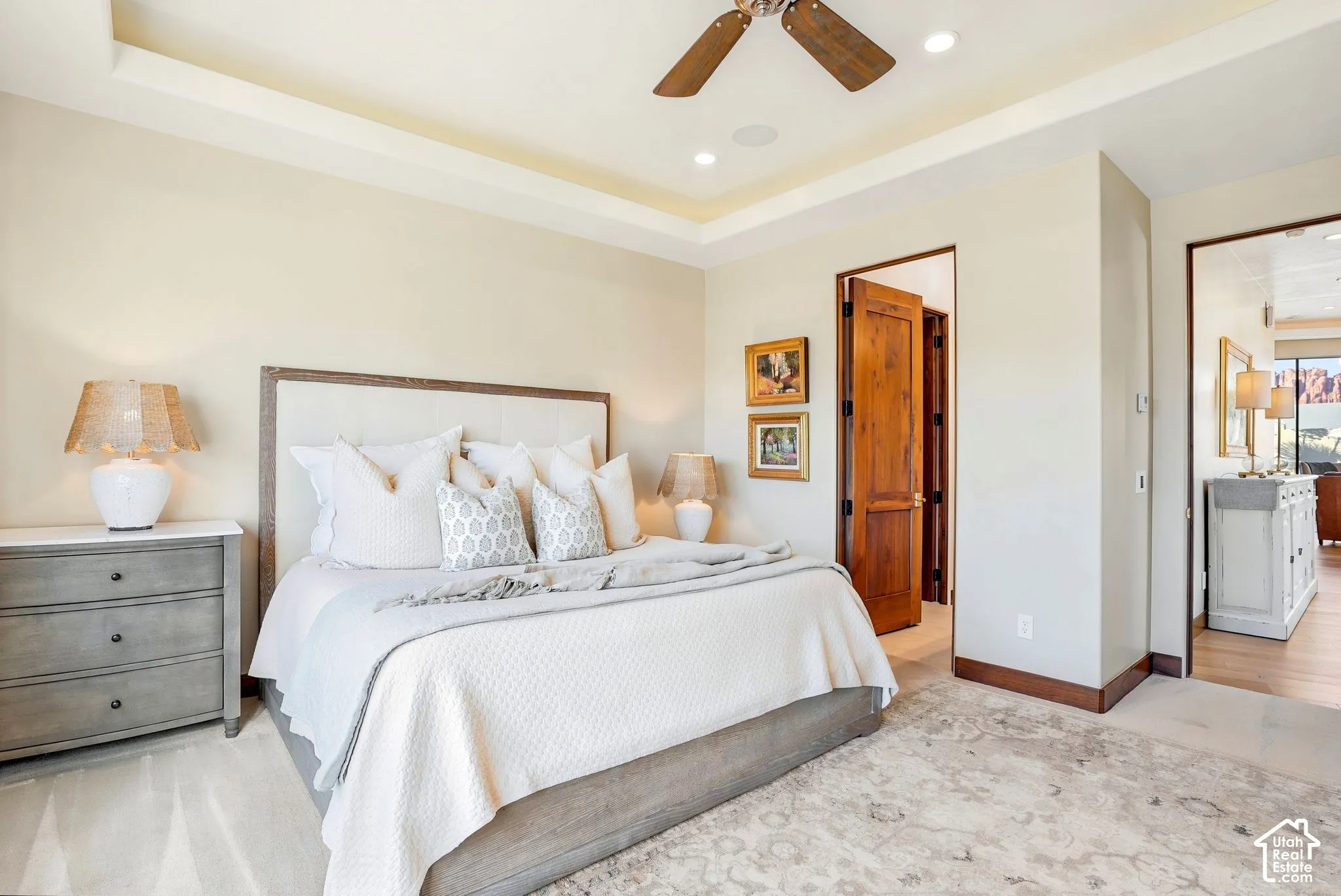 Recessed lighting, wood-finish ceiling fan, and tray ceiling
