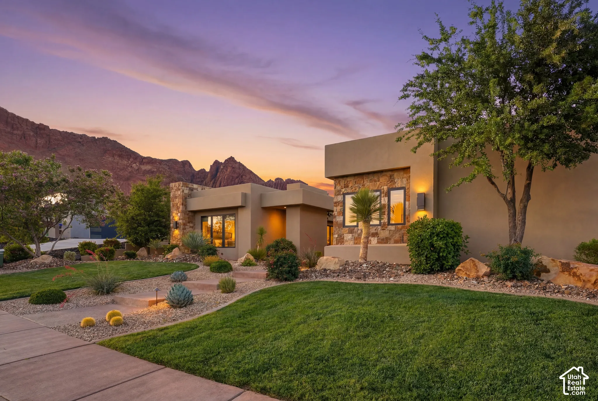 Contemporary exterior with stucco finish and stone accents