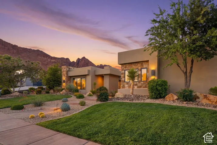 Contemporary exterior with stucco finish and stone accents