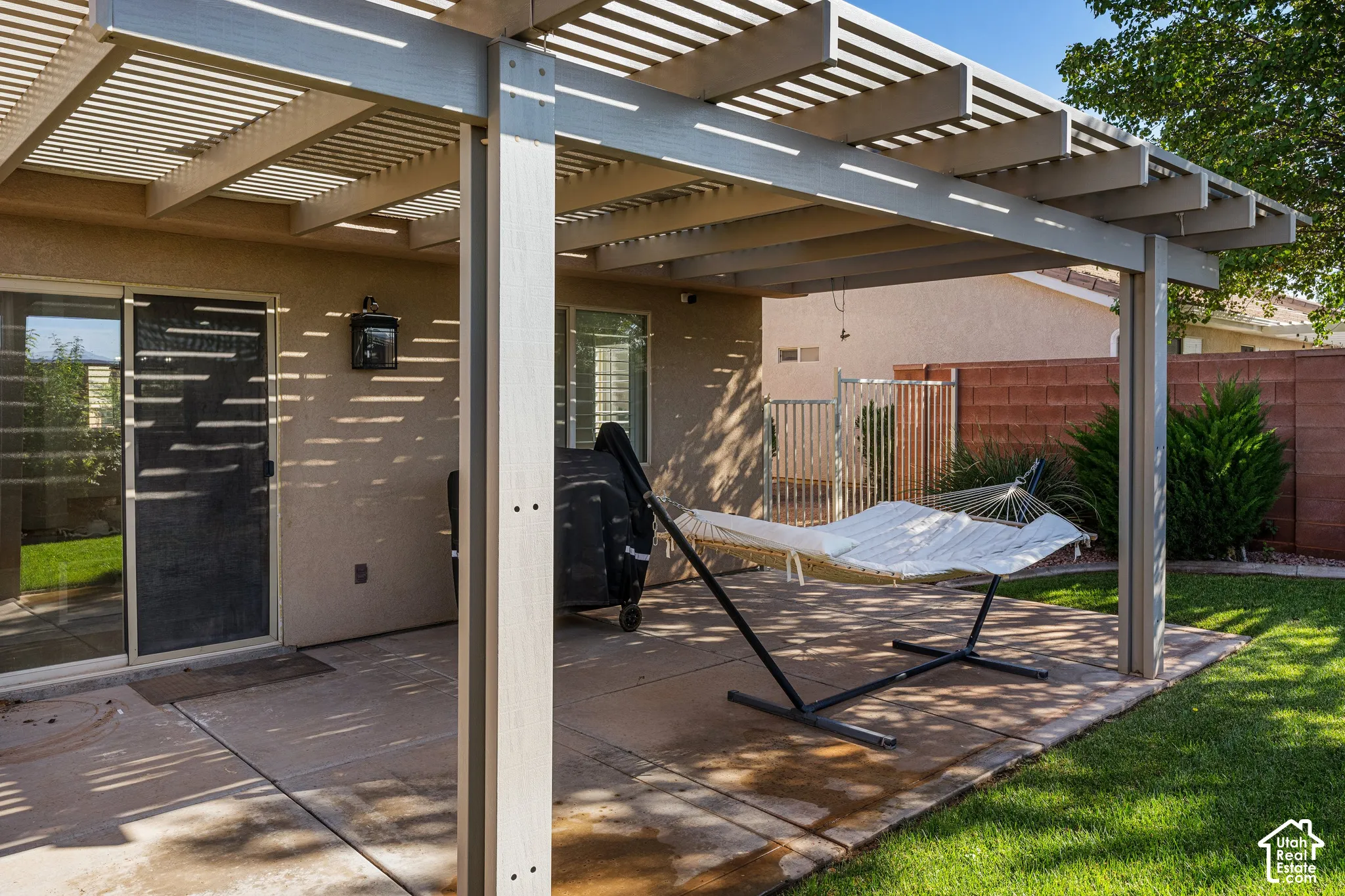 Covered patio with slatted pergola roof
