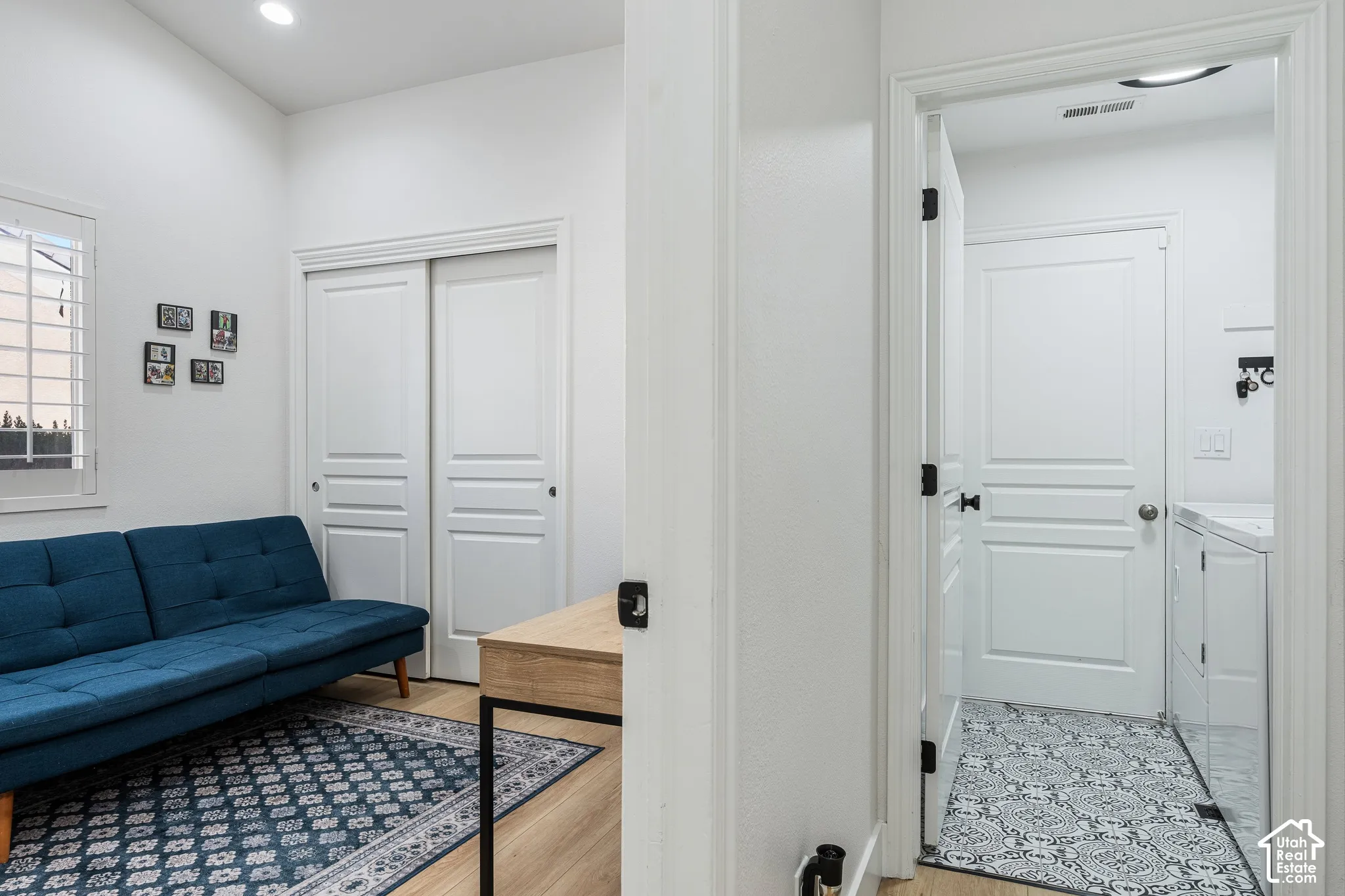 High ceilings, recessed lighting, wood-finish flooring, sliding closet doors, and a separate utility area