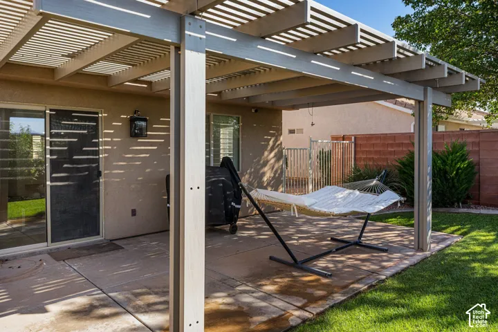 Covered patio with slatted pergola roof