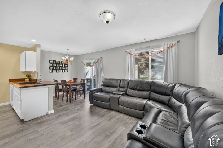 Wood-finish flooring throughout, with light gray painted walls