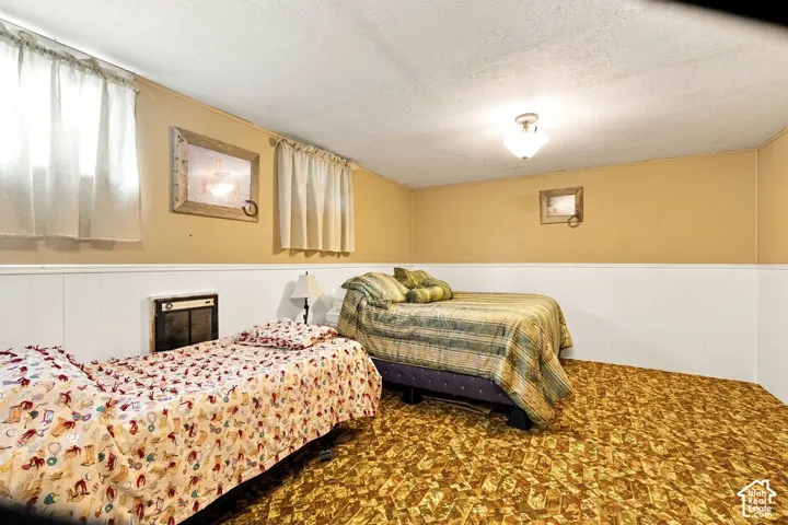 Recessed floor heater, wall-to-wall carpeting, and overhead flush mount lighting