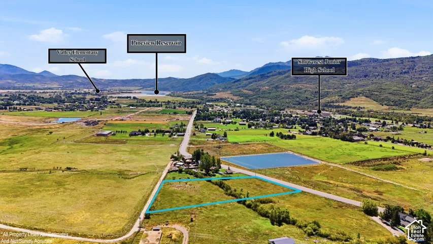 Expansive land parcel featuring open fields and mountainous surroundings