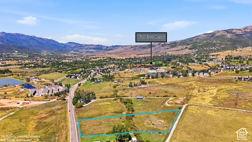 Expansive land parcel featuring open terrain and adjacent road access