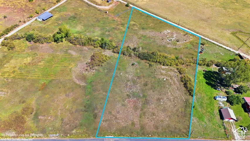 Expansive undeveloped land featuring natural terrain and a perimeter border