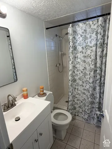 Vanity with an integrated sink, brushed nickel faucet, and white cabinetry
