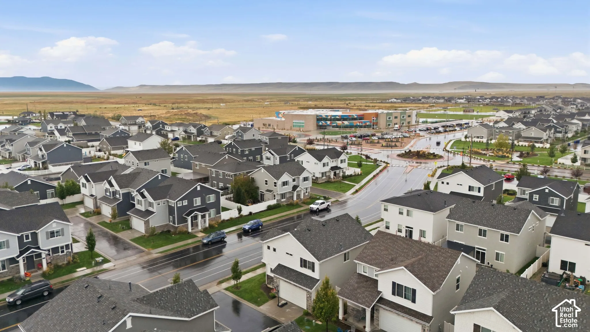 New construction residential development featuring a variety of home styles and rooflines