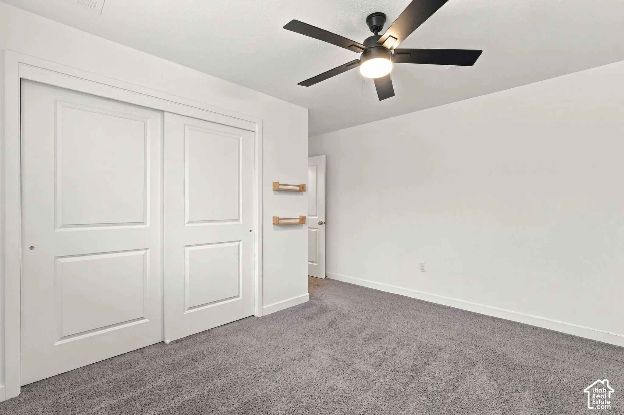 Recessed lighting, ceiling fan with integrated light, neutral carpeting, white trim work, and white paneled doors