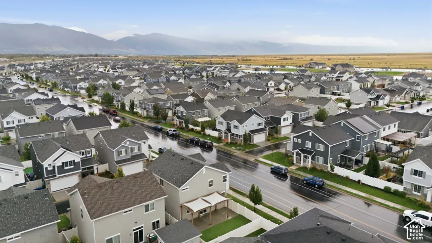 Residential neighborhood featuring a mix of architectural styles, concrete sidewalks, and asphalt streets