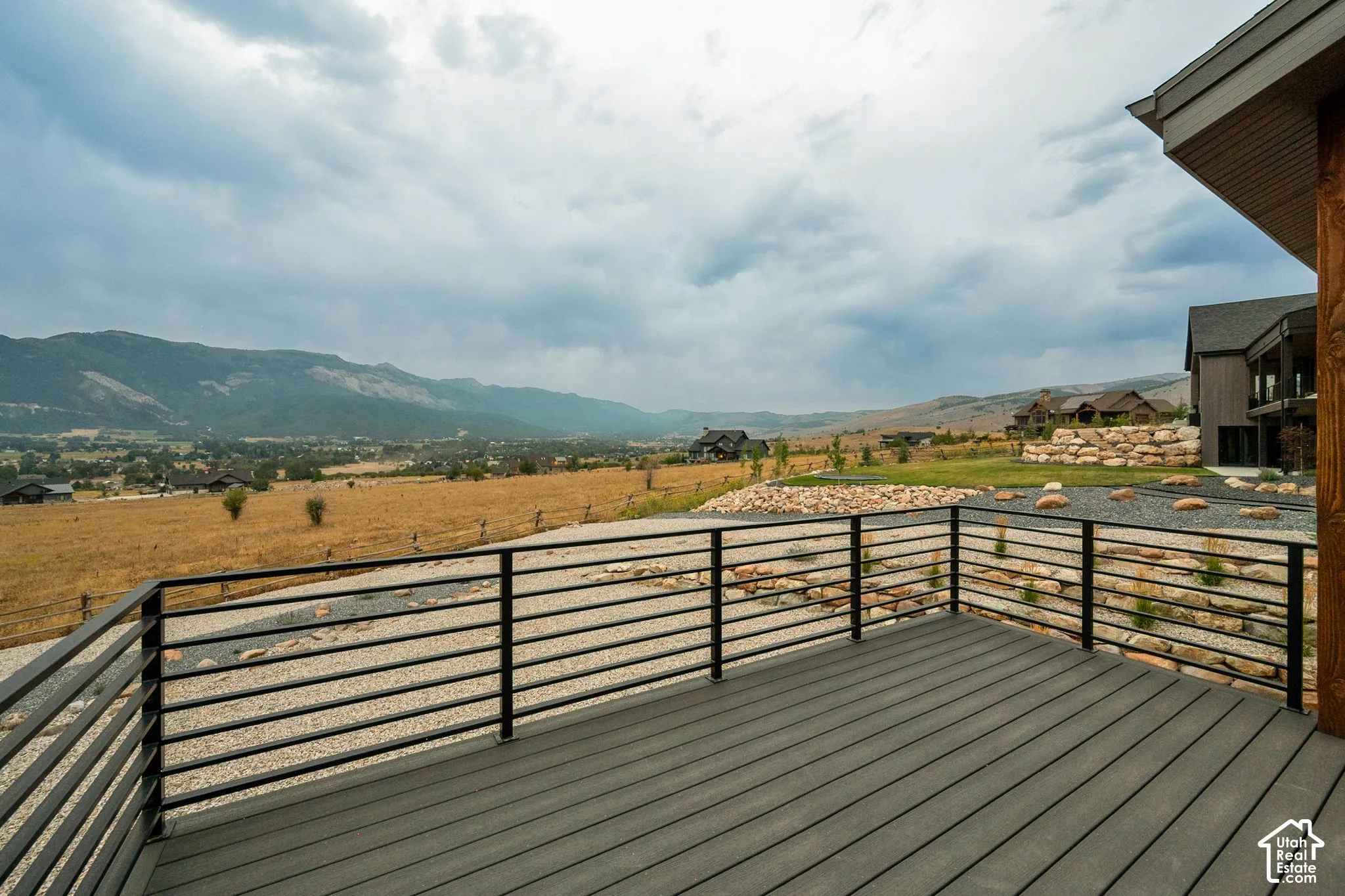 Deck with composite decking and metal horizontal railings