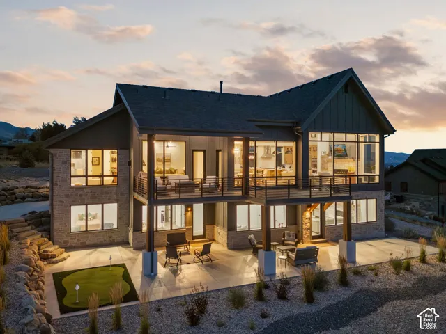 Multi-level exterior with stone and vertical siding accents