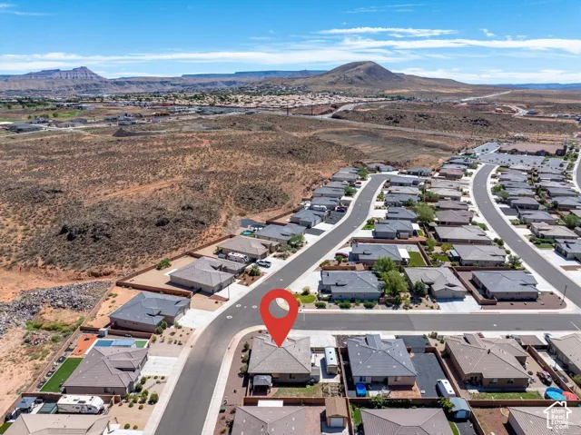 Aerial perspective of a developed residential neighborhood with paved streets