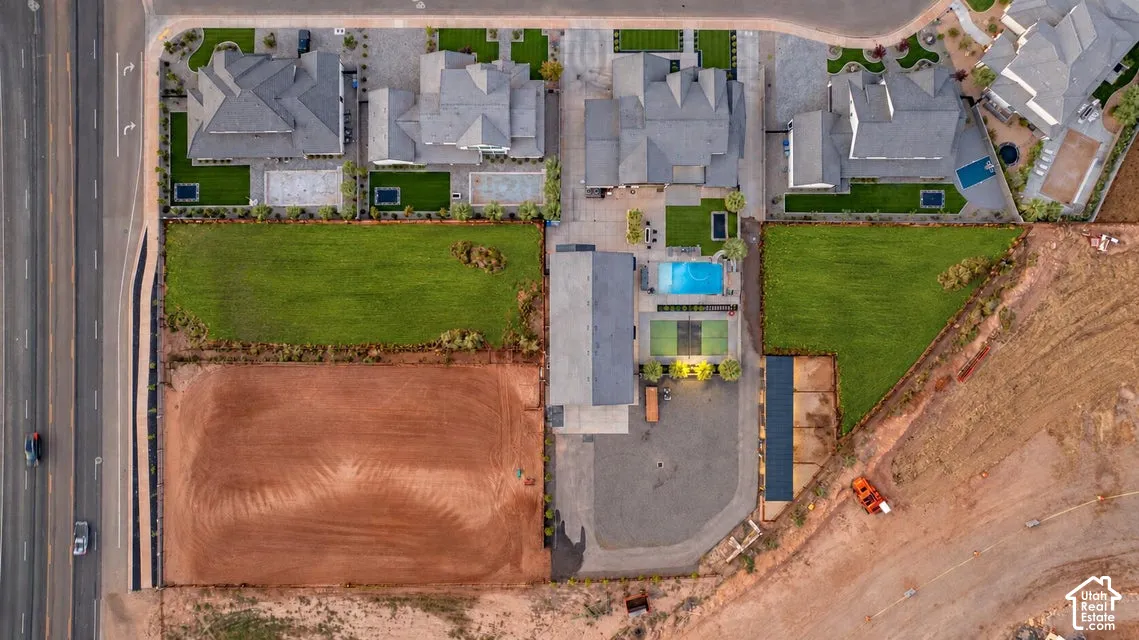 Expansive lot offering significant development potential, featuring clear ground for construction and direct road frontage