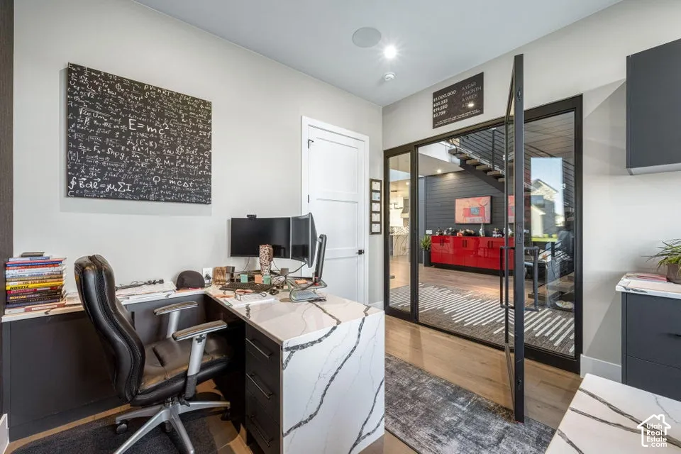 Dedicated workspace featuring a built-in desk with a white countertop