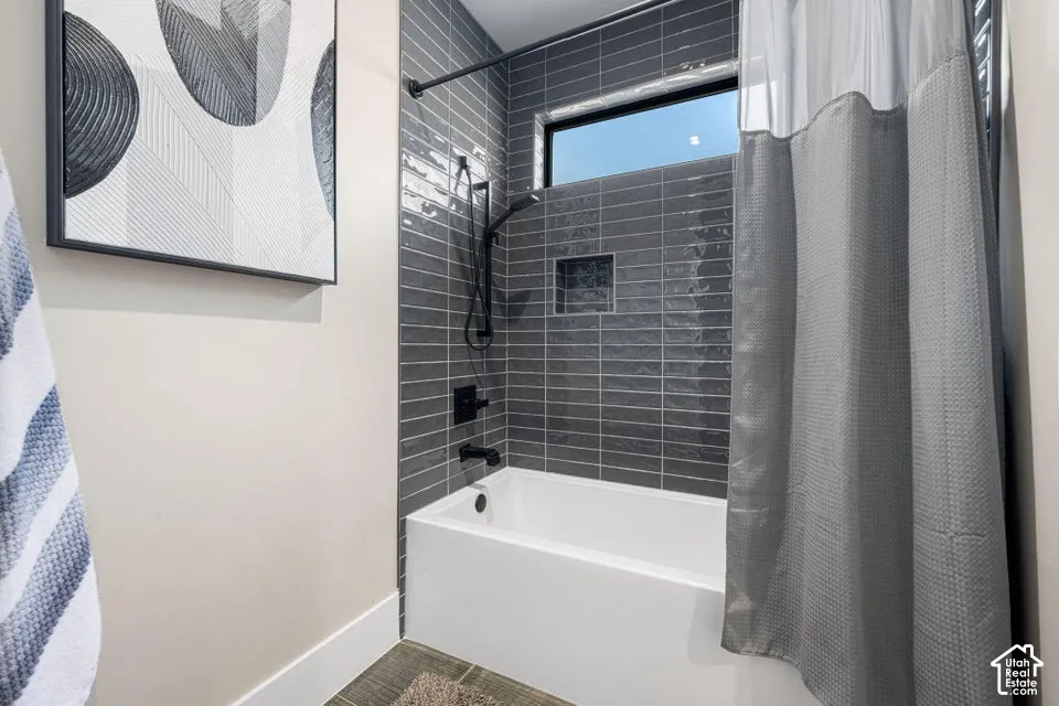 Tile-surround bathtub with matte black fixtures