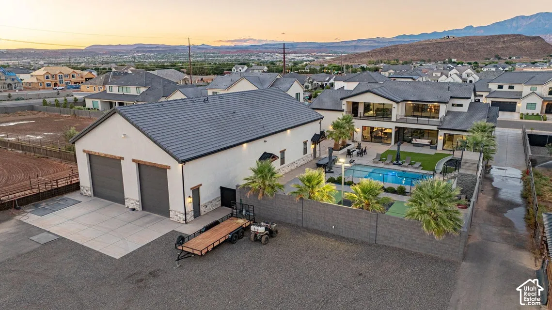 Spacious property featuring a large detached garage, private pool, and expansive patio areas