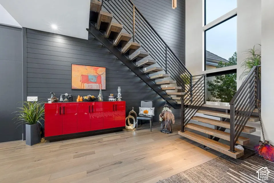 Floating staircase with wood-finish treads and metal railings