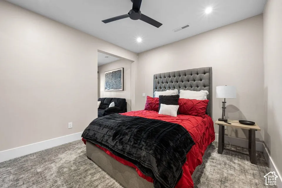 Recessed lighting, ceiling fan, and carpet flooring