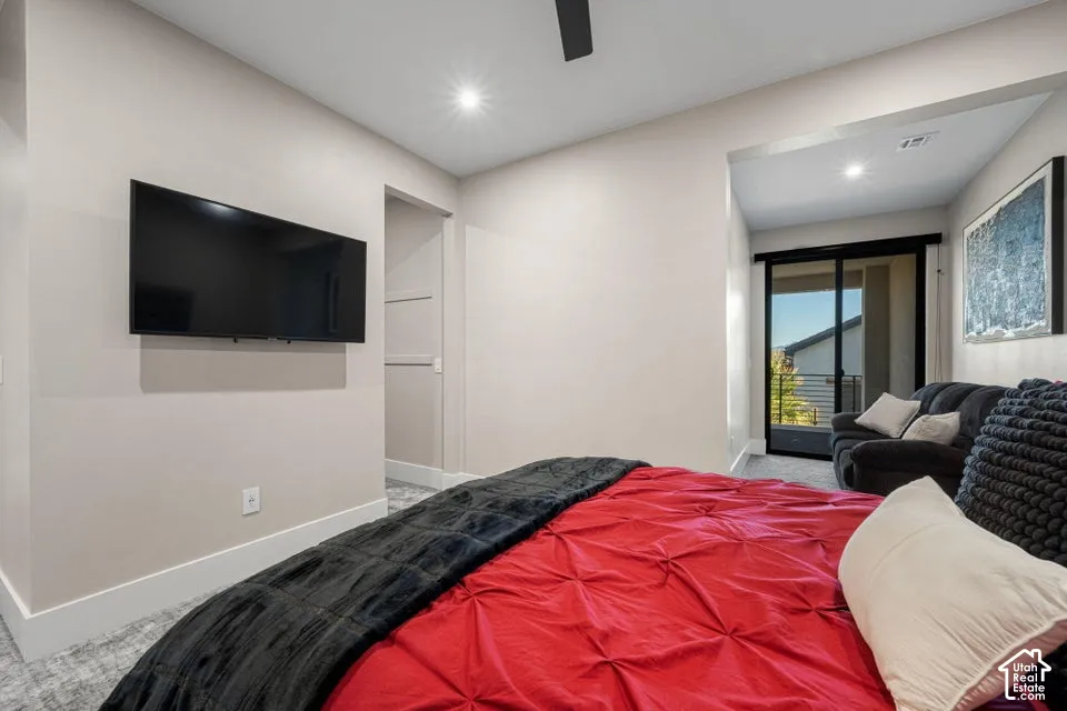 Recessed lighting, ceiling fan, sliding glass door to exterior, and carpet flooring