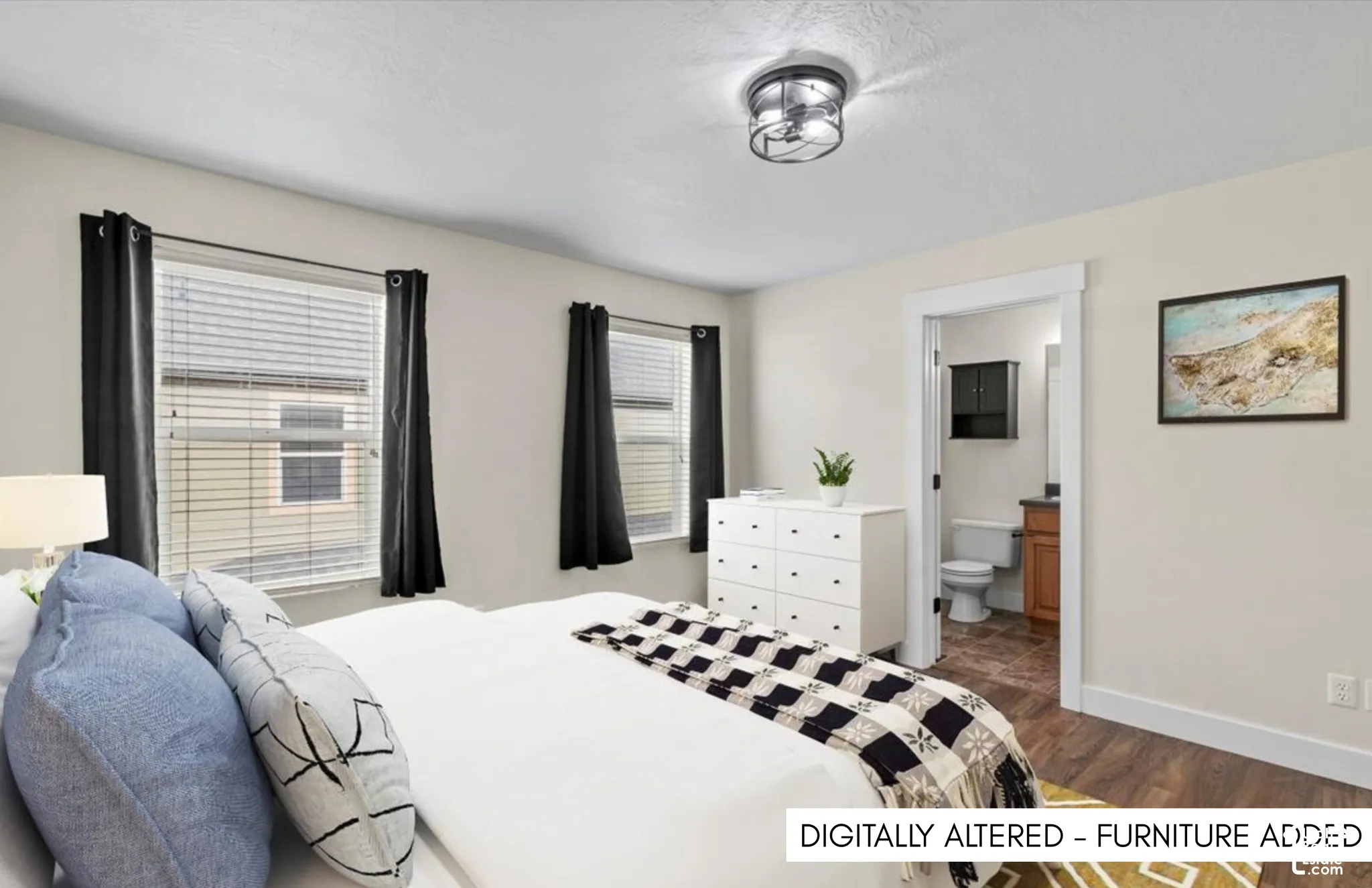 Recessed ceiling fixture with a dark metal frame