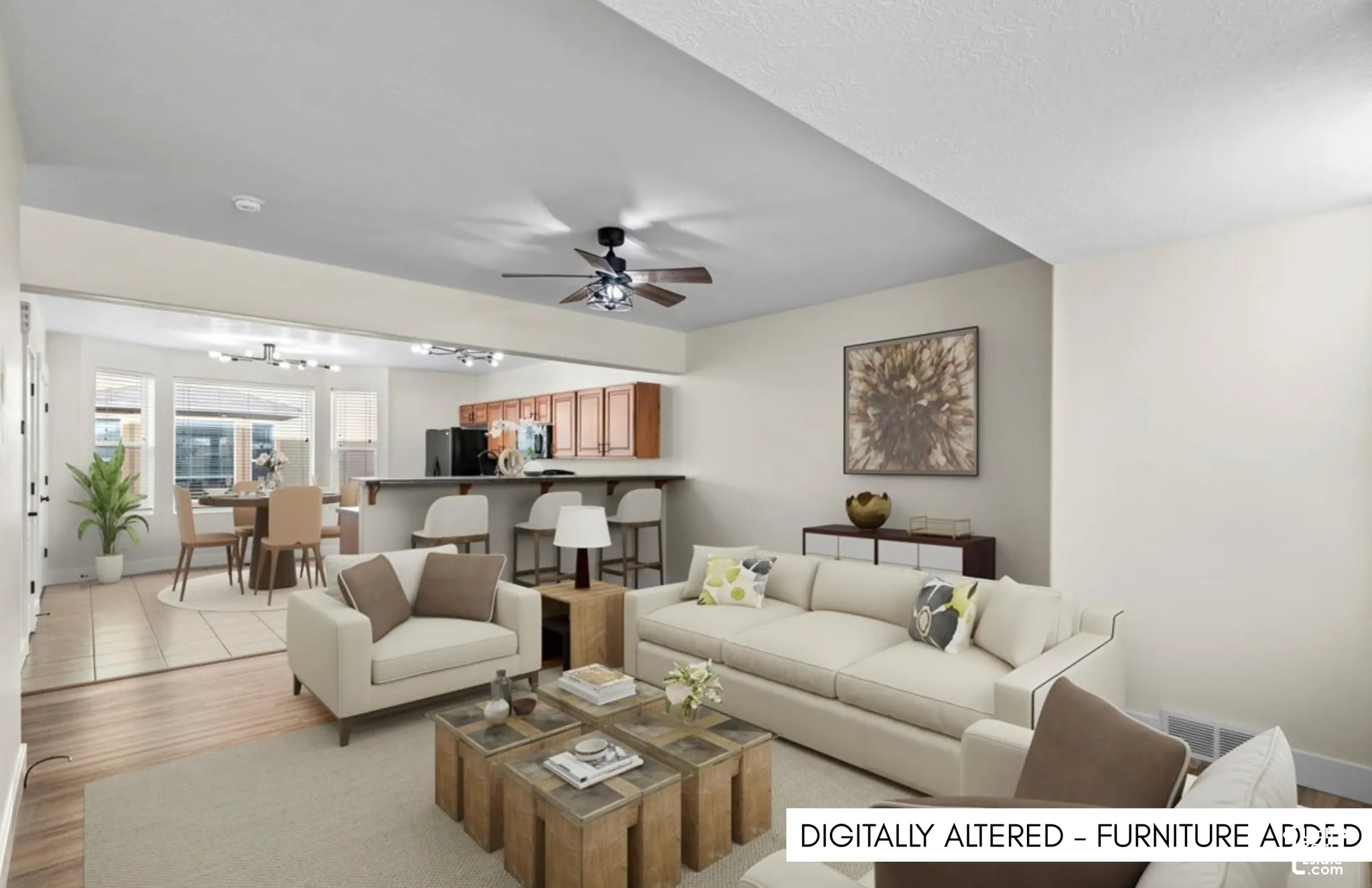 Open-concept living area with wood-finish flooring, a ceiling fan, and recessed lighting