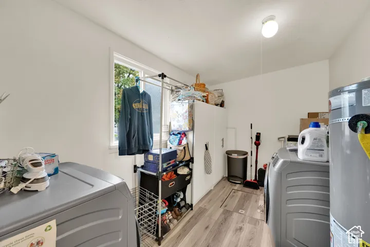 White walls, wood-finish flooring, and a single window