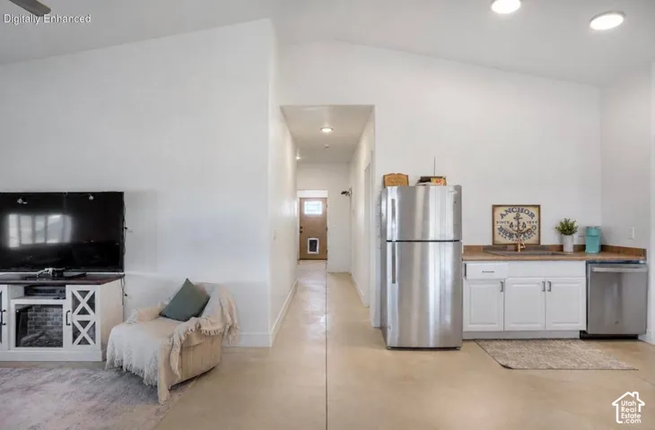Vaulted ceiling, recessed lighting, and durable flooring