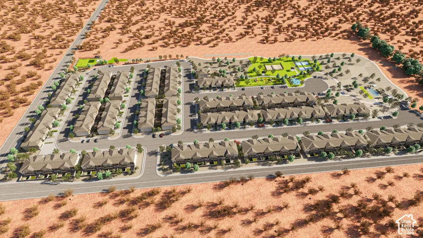Residential community featuring multiple rows of attached homes, paved roadways, green spaces, and a recreation area with courts and a pool
