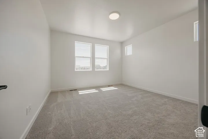 Wall-to-wall carpeting and neutral wall tones