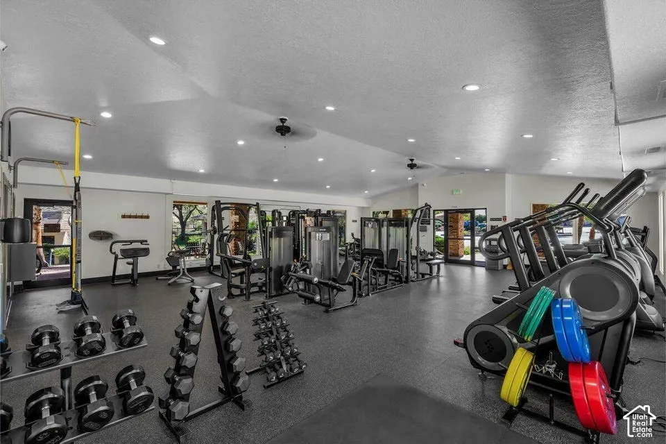 Fitness center with recessed lighting and ceiling fans
