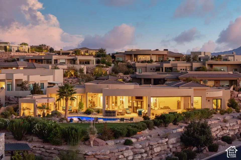 Terraced desert landscaping featuring natural rock formations and mature shrubs