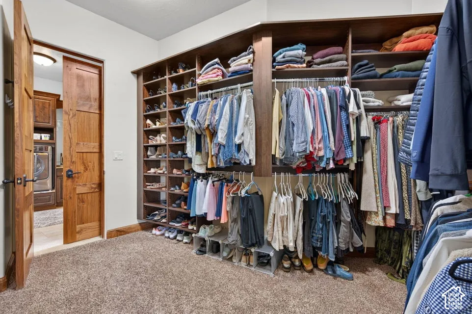 Custom built-in closet system with multiple shelving units, hanging rods, and integrated shoe storage