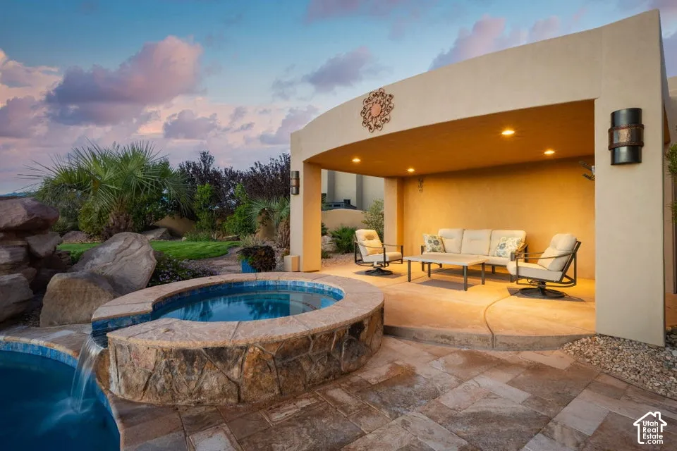 Curved stucco patio cover with recessed lighting