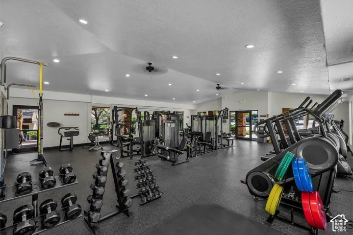 Fitness center with recessed lighting and ceiling fans