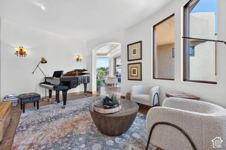 Arched entryway leading to an open living area